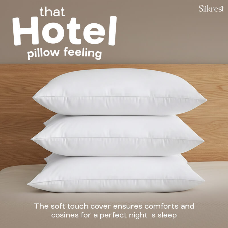 A stack of three luxurious Silkrest pillows resting on a bed, showcasing hotel-quality comfort and a soft cozy cover.